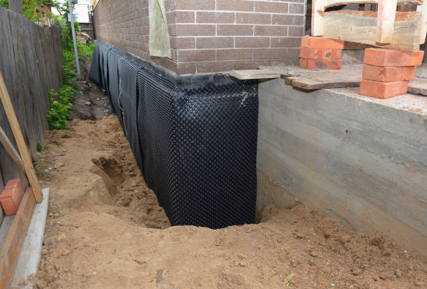 SJ Waterproofing Pros technician performing targeted Interior Drainage System assessment in Mount Calvary, WI